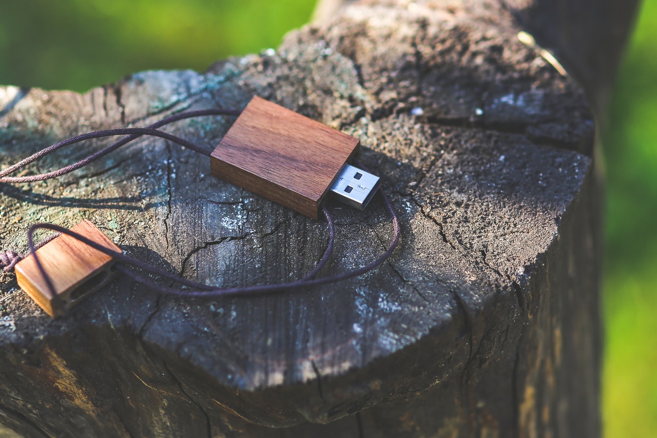 a usb drive with wooden design on a chopped wood